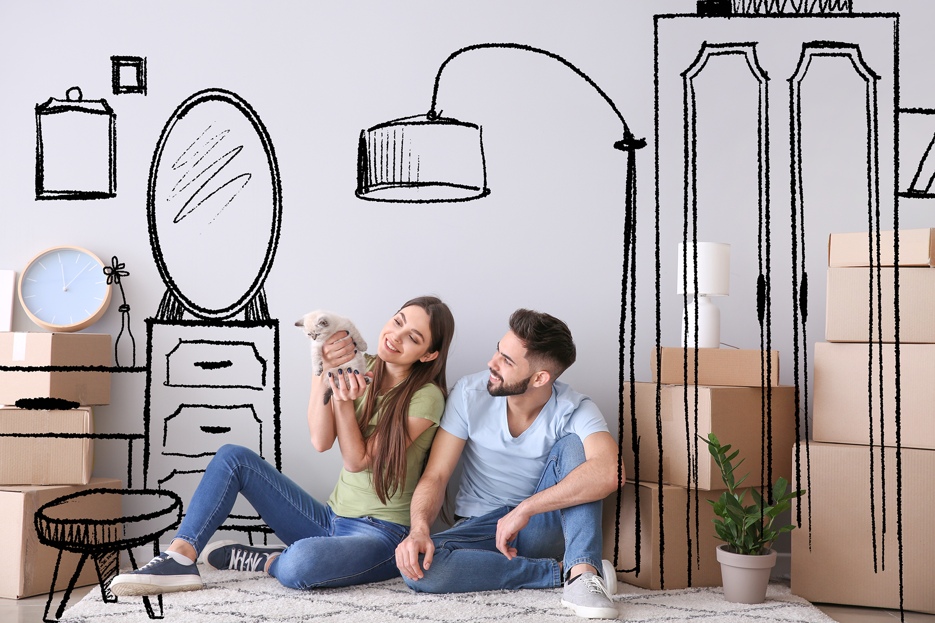 Couple enjoying new house with drawn furniture behind them
